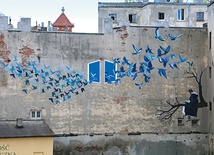 Mural na ścianie kamienicy przy ul. Próchnika 15 w Łodzi nosi tytuł „Contemplare et contemplata aliis tradere”, czyli kontemplować i dzielić się owocami kontemplacji.