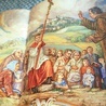 „Powitanie pielgrzymów”. Fragment polichromii w sanktuarium  św. Anny. Reprodukcja z książki.