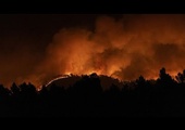 Firefighters fight raging wildfires blazing through forests in eastern Spain